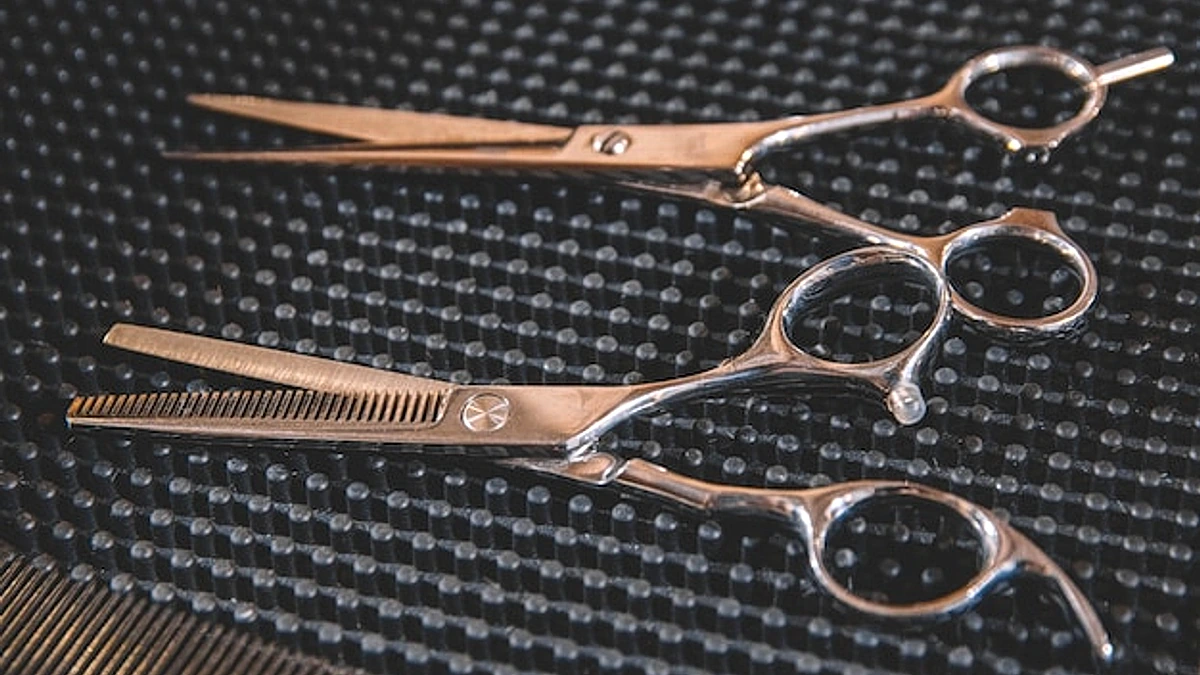 Stylish professional barber scissors. Hairdresser salon concept, hairdressing tool set