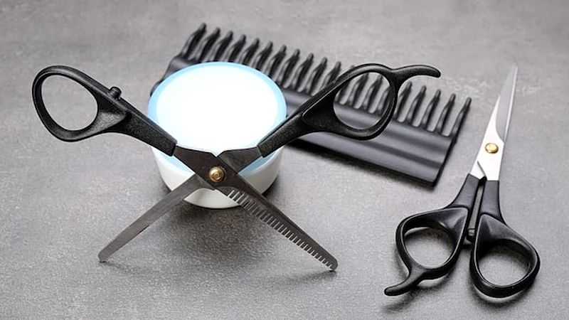 Barber set with tools and cosmetic on grey background