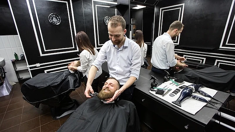 Work in a barbershop. Two masters at work.