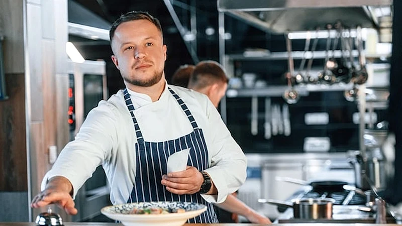 Order is complete Kitchen workers is together preparing the food