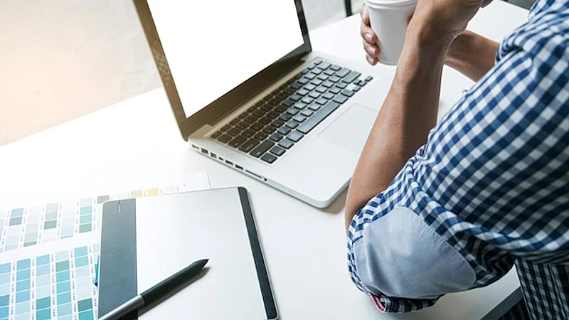 High angle view of businessman working at desk in office